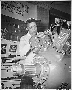 Thumbnail for "Inspecting a Grumman Wildcat engine on display at the U.S. Naval Training School (WR) Bronx, NY, where she is a `boot' is WAVE Apprentice Seaman Frances Bates."