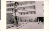 Photograph of an unidentified woman on the diving board at Carver House Hotel and Casino