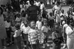 Child Development Center children and adults looking up at balloons, Los Angeles, 1987