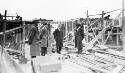 Unidentified group of men standing in construction site