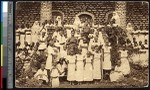 Missionary sisters pose with girls in white dresses, Congo, ca.1900-1930