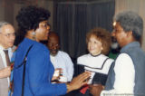 Darlene Roy talking with four others