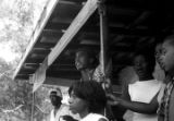 Edward Rudolph and others, standing on the porch of the Autauga County Improvement Association office in Prattville, Alabama, on the day of a civil rights march.