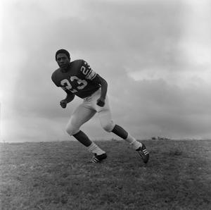 Football player running away, 11