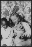 [Portrait of Tallulah Bankhead, and Julius Perkins, Jr., with lion cub Winston Churchill]