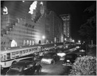 Buses full of soldiers outside Fox Theater ("colored entrance" sign visible)