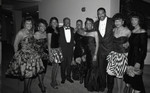 Willie Brown posing with attendees of a formal event, Los Angeles, 1989