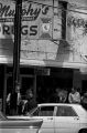 Thumbnail for Protestors carrying signs while marching past Murphy's Prescription Drugs in downtown Prattville, Alabama, during a civil rights demonstration.