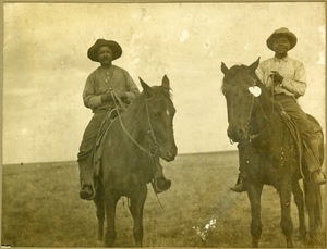 Cowboys on horseback