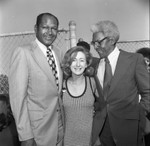 Bayard Rustin and Tom Bradley posing with an unidentified woman, Los Angeles, 1973