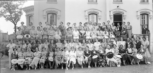 Large group of women outside in front o building] [acetate film photonegative, banquet camera format.