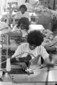 Women sewing on machines at Tuskegee Mills in Macon County, Alabama.