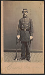 [Musician Charles W. Grimmer of 17th Regular Army Infantry Regiment in uniform with horn and sword]