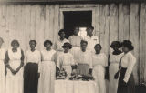 African American women standing around a table of baked goods in Madison County, Alabama.