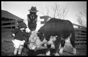 Man and Toddler with a Calf