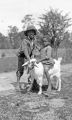 Two African American children with a goat in rural Wilcox County, Alabama.