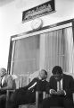 Martin Luther King, Jr., sitting behind the podium during a meeting at Maggie Street Baptist Church in Montgomery, Alabama.