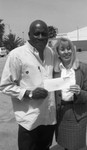 Lou Dantzler receiving a donation, Los Angeles, 1996