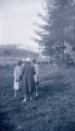 Four women talking in yard