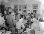 Men at a diner in Demopolis, Alabama, gathered to watch the World Series on a small television set.