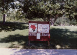 Image of signs, protests and displays put together by the SAA group on the University of Utah campus during political activity of the worldwide community to put an end to segregation in South Africa.