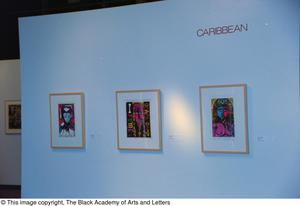 Photograph of a Caribbean gallery wall, featuring three art works