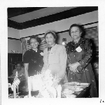 Chlora Hayes Sledge (center) and two unidentified women standing next to banquet table