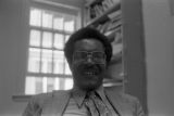 John Blassingame: New York. John Blassingame seated in office, Fredrick Douglas portrait on the wall (BLJP 1-79 #101)