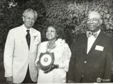Theola Jennings receiving an award from Maurice Mitchell, Chancellor University of Denver