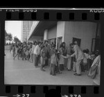 Mayor Tom Bradley greeting underprivileged children at screening of film, "Pete's Dragon," at Century City, Calif., 1977