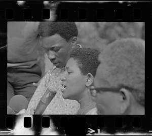 Unidentified woman, most likely a Black community leader or activist, speaking during Black student rally in Franklin Park