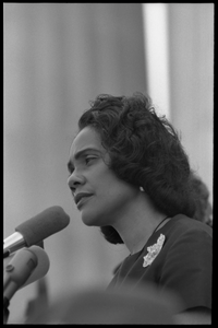 Coretta Scott King addressing the Solidarity Day crowd at the Poor People's March on Washington, speaking against the War in Vietnam Portrait in profile, at the microphones