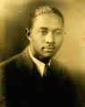 Arthur McCullough, Jr. Wearing a Dark Colored Blazer