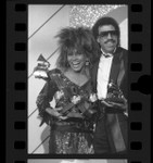 Singers Tina Turner and Lionel Richie posing with their Grammy Awards in Los Angeles, Calif., 1985