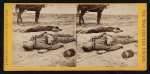 Rebel artillery soldiers, killed in the trenches of "Fort Hell," at the storming of Petersburgh, Va., April 2d, 1865 The one in the foreground has U.S. belts on, probably taken from a Union soldier prisoner, his uniform is grey cloth trimmed with red. This view was taken the morning after the fight.