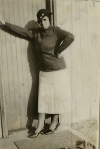 Young Henrietta Cephas Brown leaning against a door