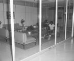 Students in the lobby of a building at Tuskegee Institute in Tuskegee, Alabama.