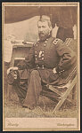 [Lieutenant General Philip Henry Sheridan of 13th Regular Army Infantry Regiment, 2nd Michigan Cavalry Regiment, U.S. Volunteers Infantry Regiment and Regular Army Infantry Regiment in uniform seated on camp chair]