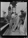 Baltimore, Maryland. A chipper removing excess metal from a welded seam during the construction of the Liberty ship Frederick Douglass at the Bethlehem-Fairfield shipyards