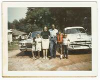 Thumbnail for A Family Standing in Front of Cars, September 4, 1967