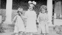 Personal. Helen Davis in between two unidentified girls