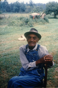 Unidentified Tippah County man, seated on a chair outside