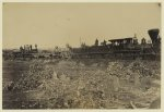 Remains of wreck on the track, ready for transportation to Alexandria.  This train was thrown from the track by the Rebels