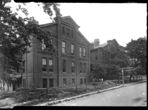 Two large 4-story buildings on unidentified street : cellulose acetate photonegative.