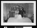 Couple prepare to cut their wedding cake, Oct. 29, 1943, Los Angeles