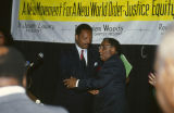 Jesse Jackson greeting Joseph Lowery at the annual meeting of the Southern Christian Leadership Conference (SCLC) in Birmingham, Alabama.