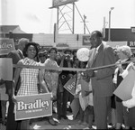 Thumbnail for Tom Bradley cutting a ribbon with Yvonne Brathwaite Burke during his mayoral campaign, Los Angeles, 1969