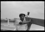 Negro stevedores handling lumber in unloading process, unloading the "El Rito," Pilottown, Louisiana