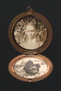 Locket with photographs of Harriette and Harry T. Moore