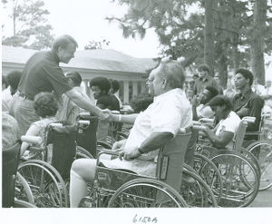 Photograph of Georgia governor Jimmy Carter shaking hands with patients at the Georgia Warm Springs Foundation, Warm Springs, Meriwether County, Georgia, 1973